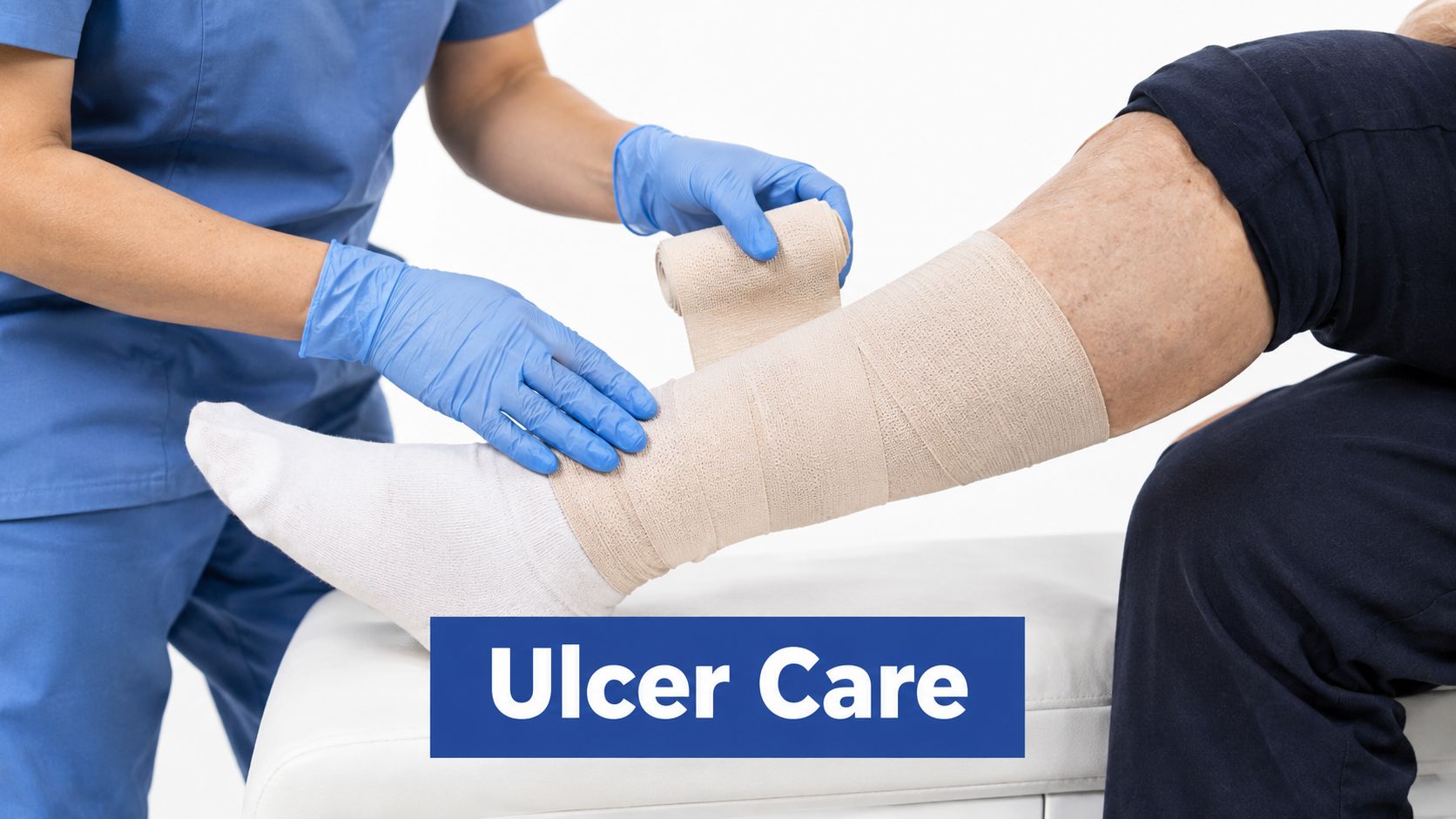 A healthcare professional wearing blue scrubs and gloves wraps a bandage around an elderly patient's lower leg.